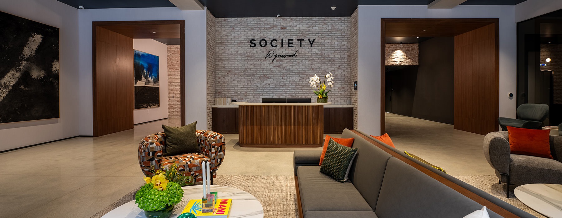 lobby with desk and brick wall